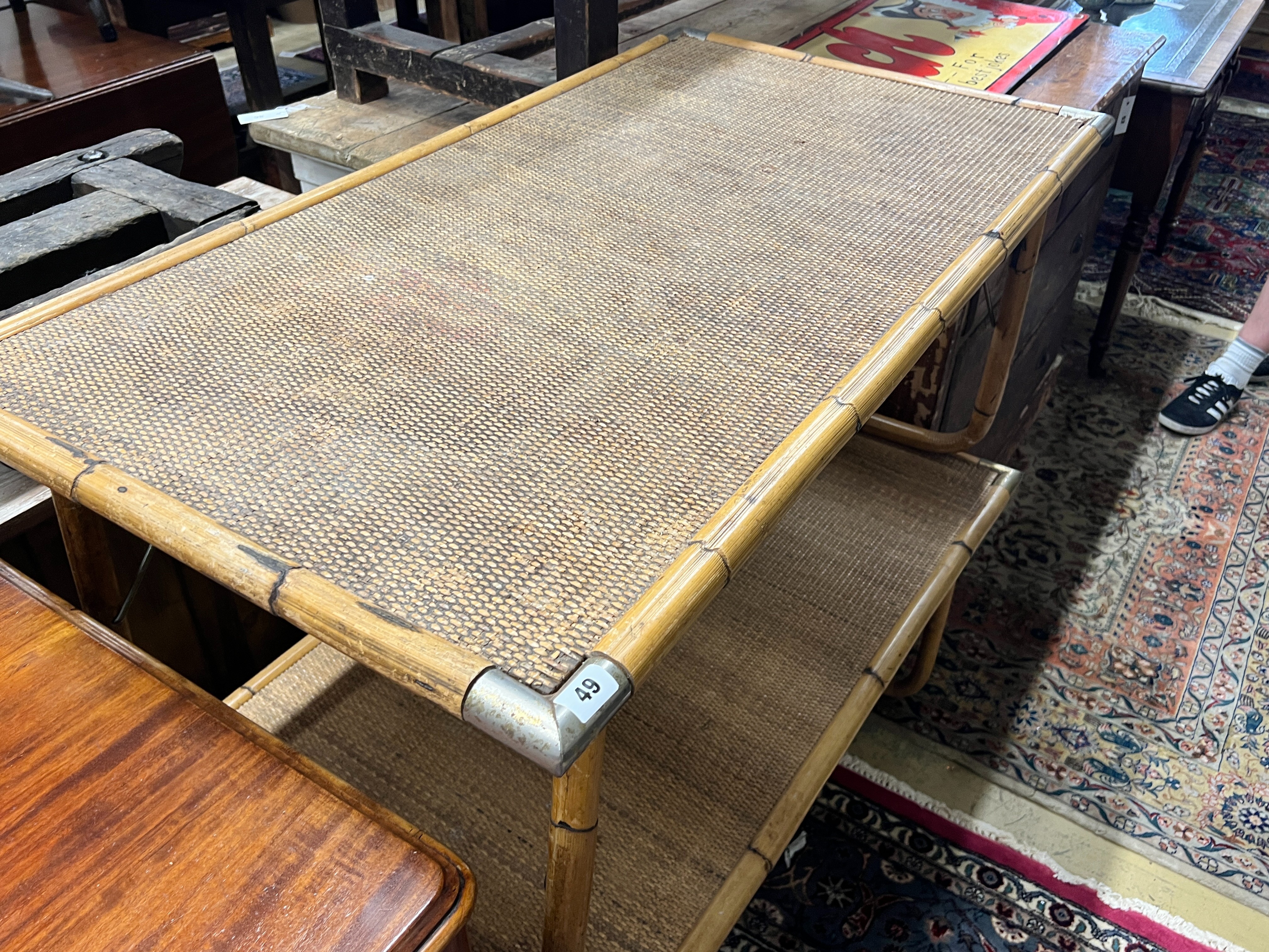 A pair of rectangular folding caned bamboo and rattan low tables, width 110cm, depth 60cm, height 52cm